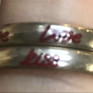 2 stackable silver rings with love written in red